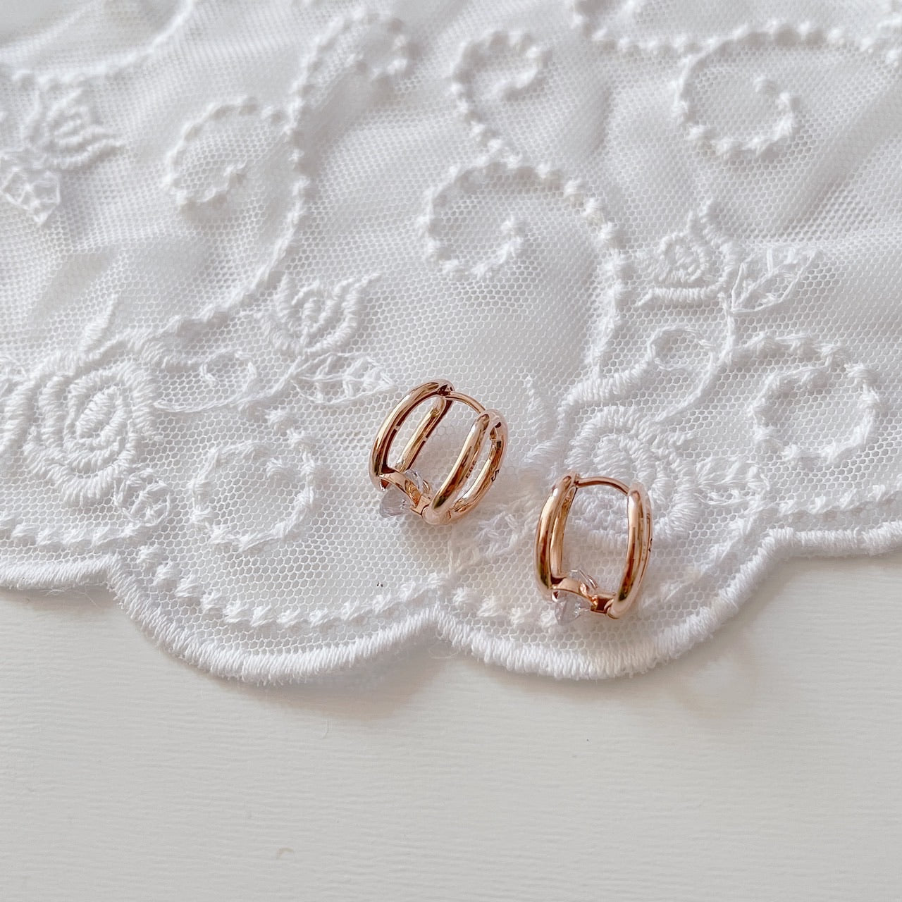 Cubic oval huggie earrings