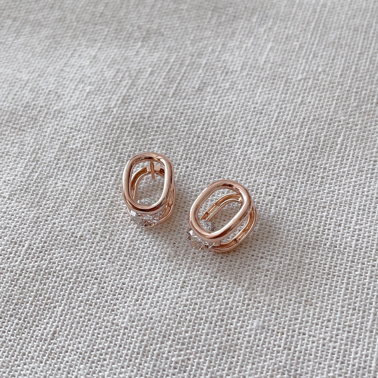 Cubic oval huggie earrings