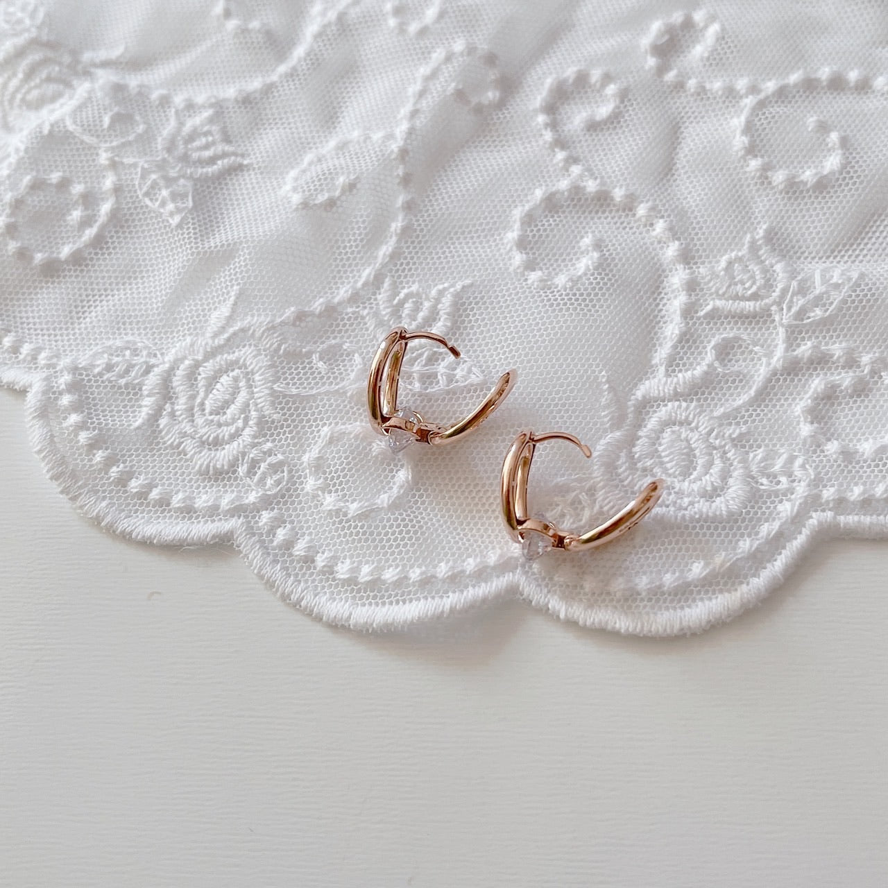 Cubic oval huggie earrings