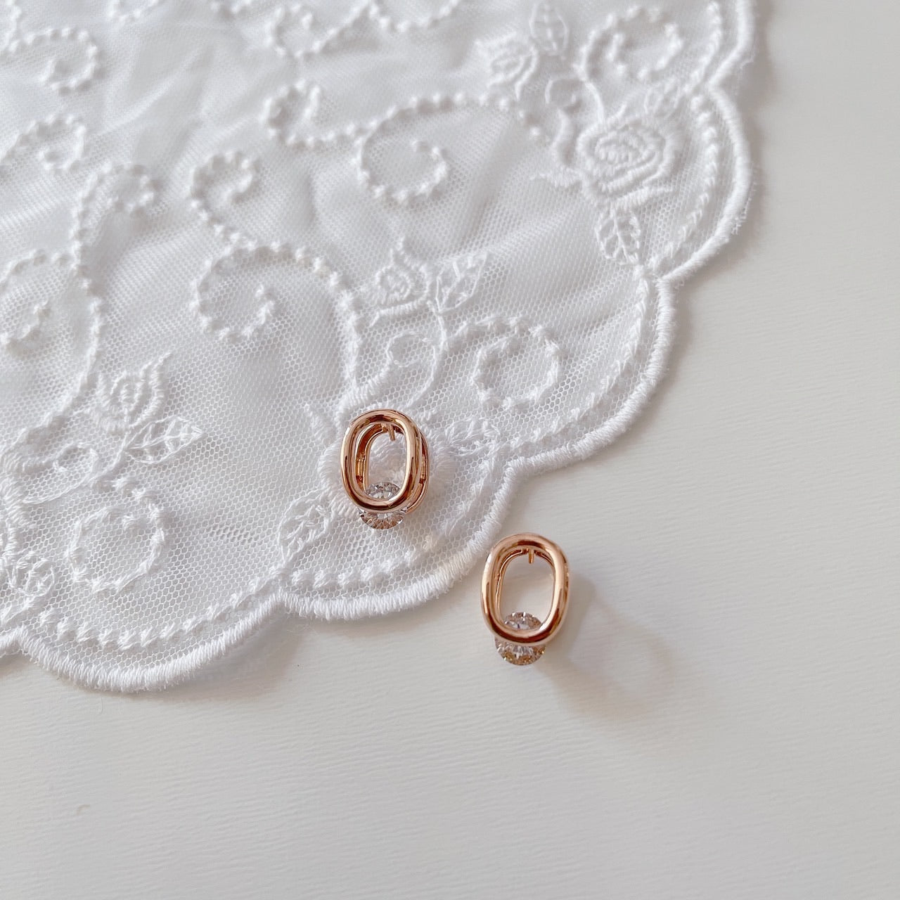 Cubic oval huggie earrings