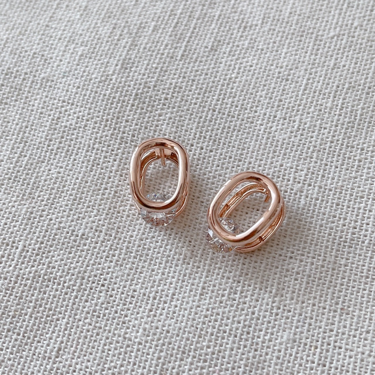Cubic oval huggie earrings